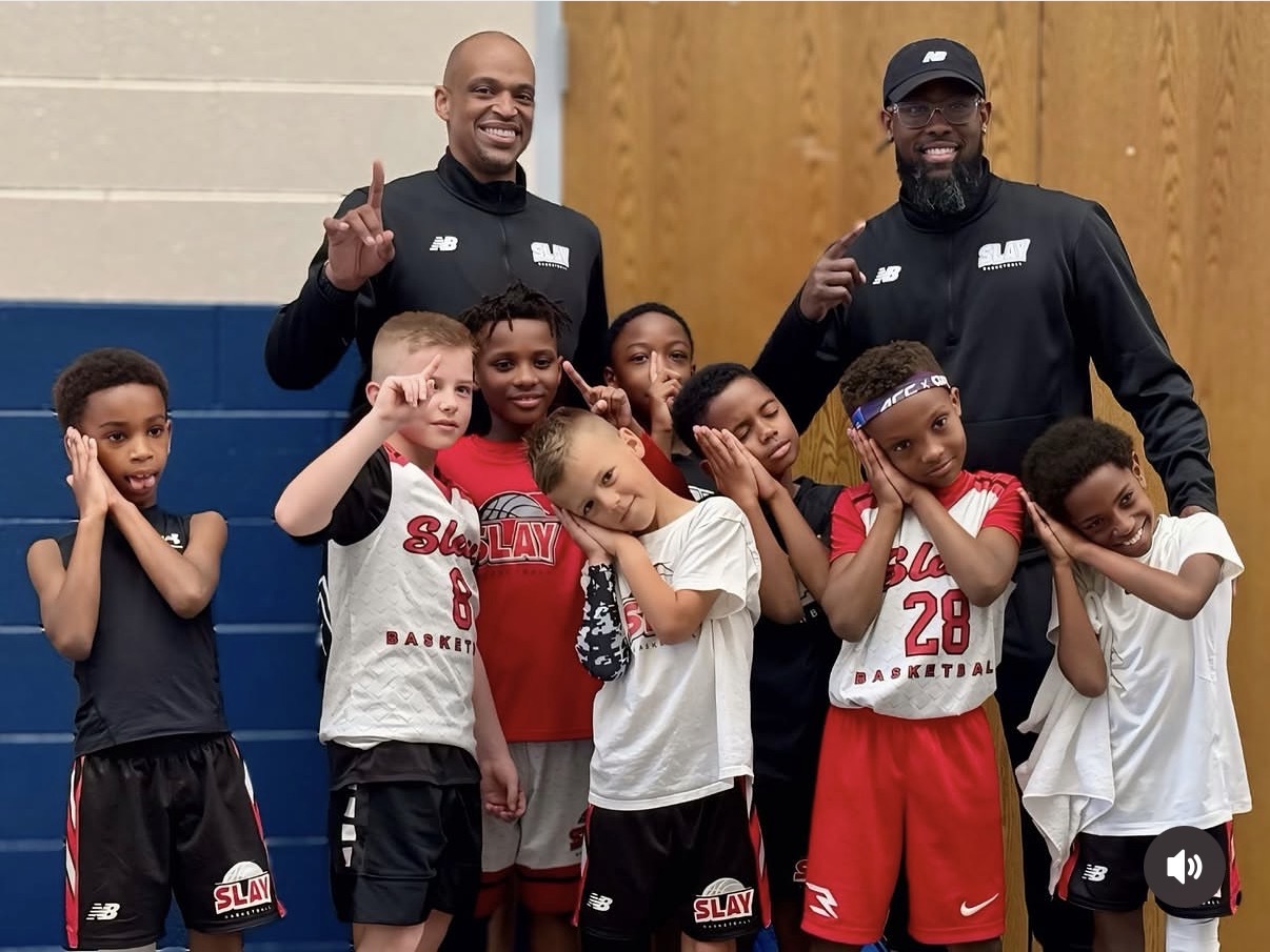 Ashaunte McLean coaching youth athletes with the SLAY basketball team