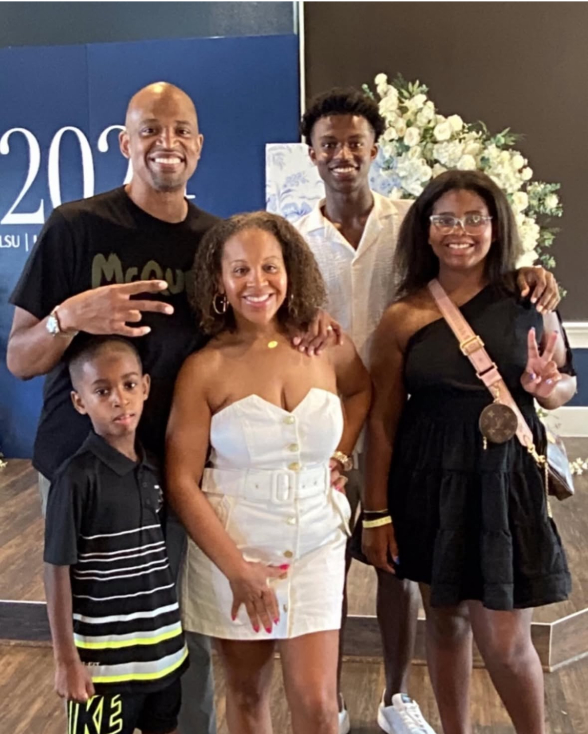 Ashaunte McLean with his wife and three children at an LSU celebration